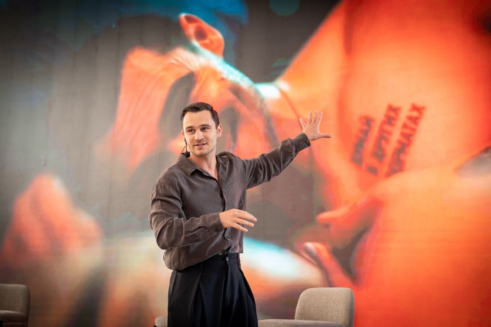 Julian Kostov speaking on stage